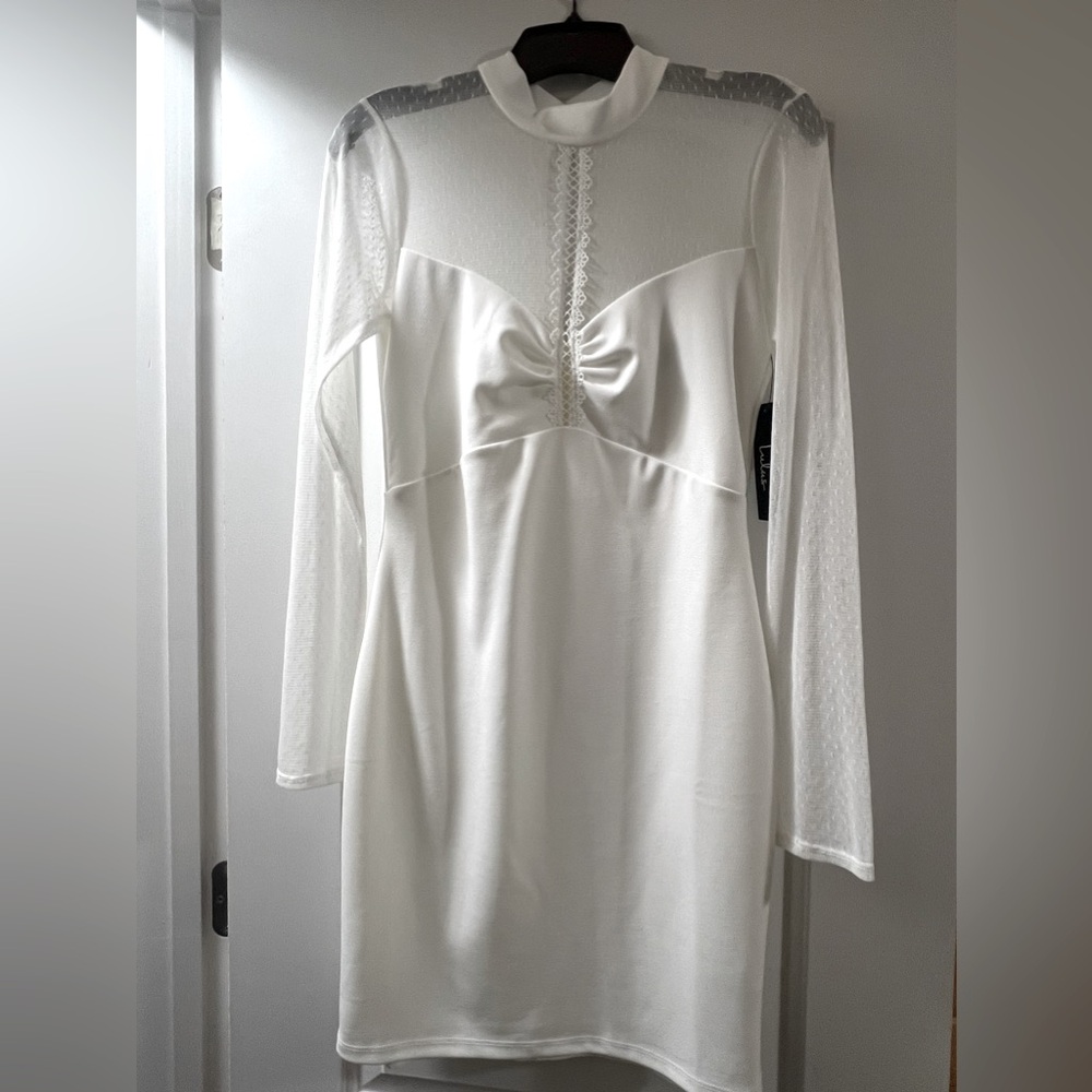 New White dress fitted with long sheer sleeves